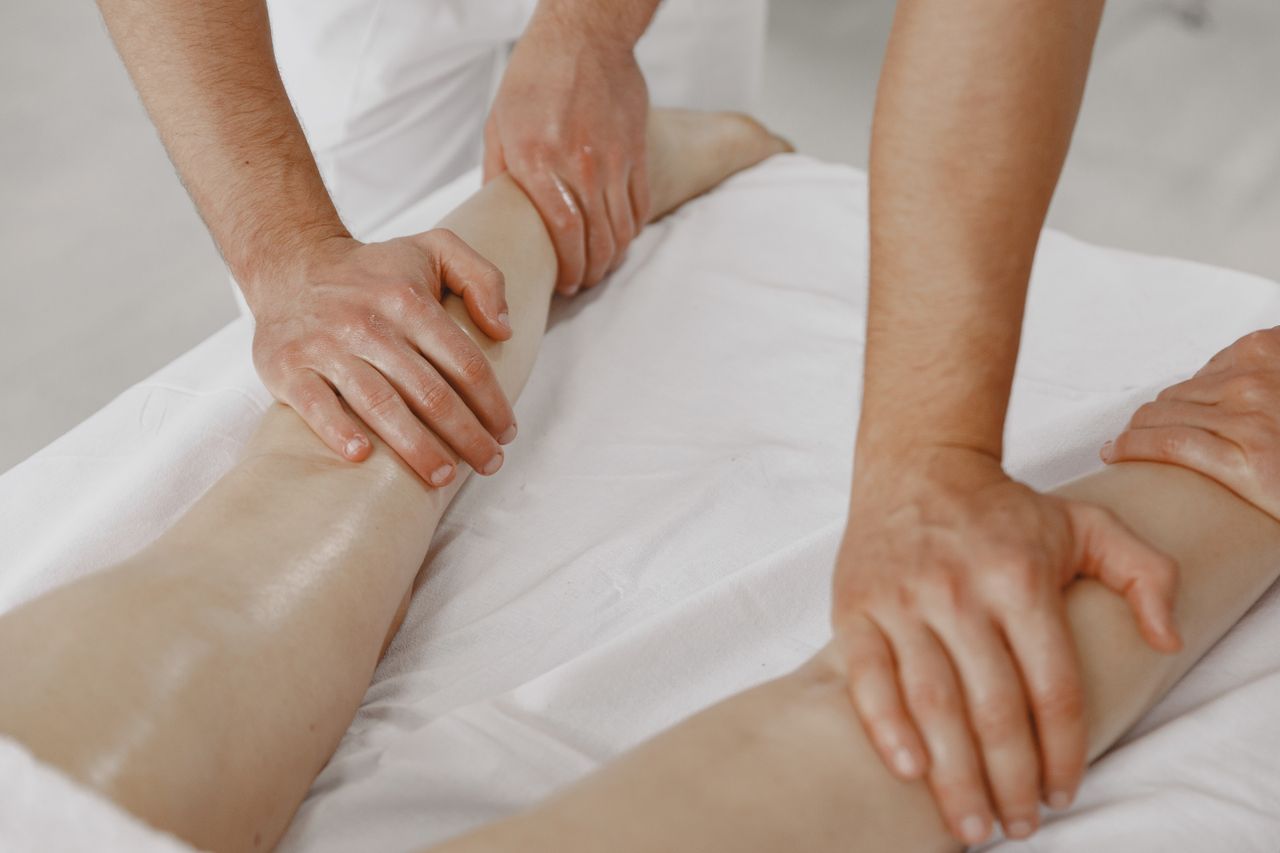 social-feed-img-03 A close-up view of a leg massage in a relaxing spa environment.
